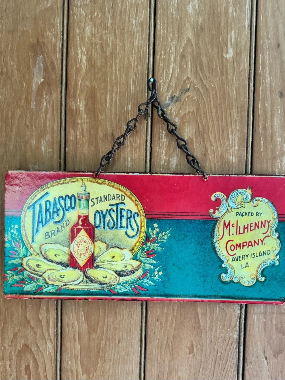 Metal chain hanging wall decor sign Tabasco Sauce with oysters on a plate image